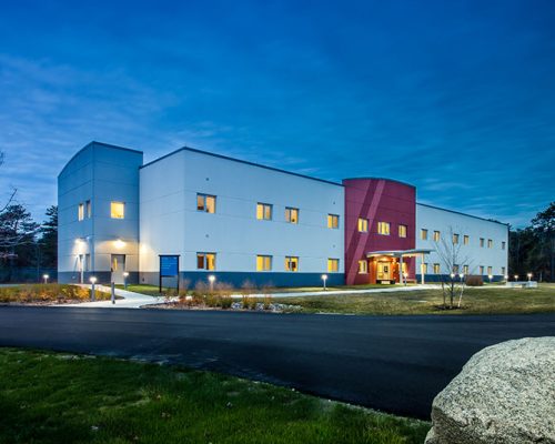 Nighttime photo of Cape Cod UPH building exterior