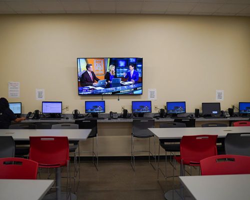 Quik Trip Training Room with workstations and video display