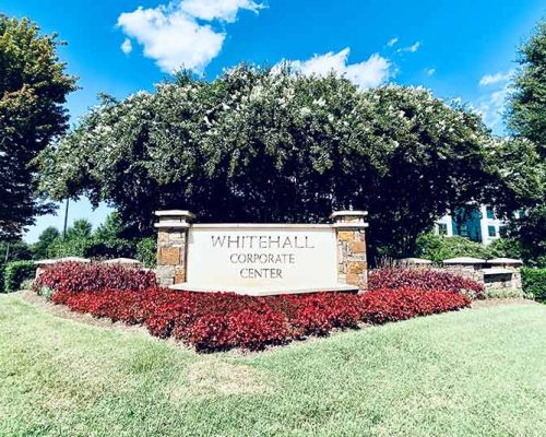 Whitehall Corporate Center sign with landscaping