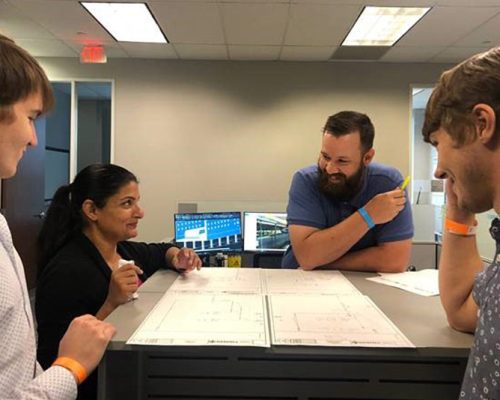 Haskell employees discussing a project in the Dallas office