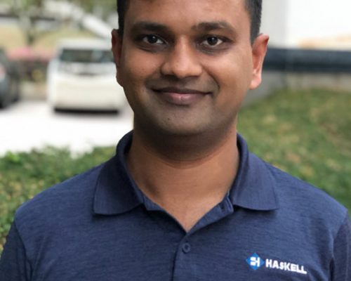 Singapore employee posing in Haskell branded attire