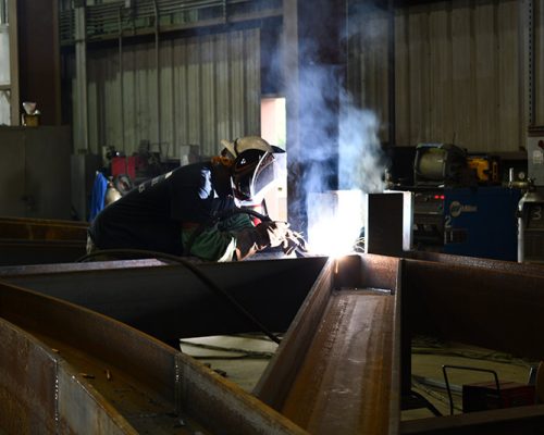 Welder at work in the Haskell Steel Shop