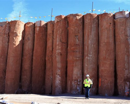 Retaining wall piles under construction