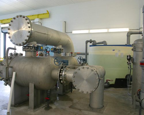 Large pipes inside the facility at the SMRU Water Treatment Facility