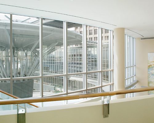 Interior photo of Baptist Heart Hospital, looking out window and over balcony.