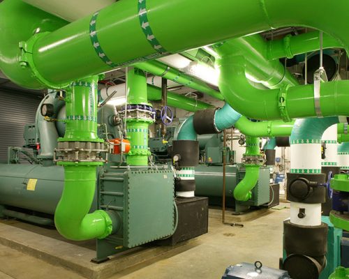 Mechanical room with lime green pipes