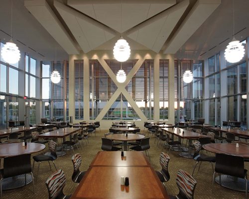 Dining Room with high ceiling and glass walls on all sides