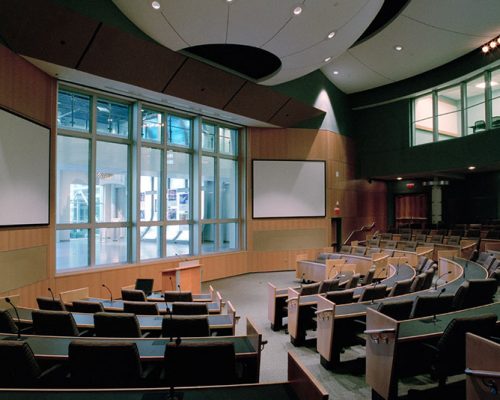 Auditorium seating and speaker podium within the GE Aviation Learning Center.