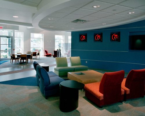 Interior seating area in the GE Aviation Learning Center with colorful walls and furniture.