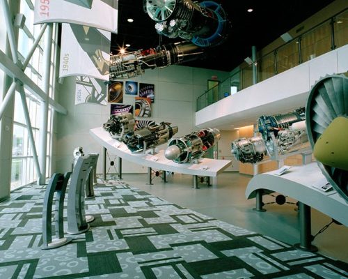 Inside the lobby of the GE Aviation Learning Center with sculptures surrounding the entryway.