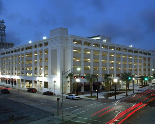 Exterior photo of City of Jacksonville parking garage at dusk.