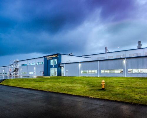 Exterior of Lufthansa Technik Heavy Maintenance Facility at dusk.