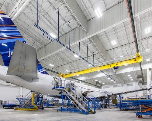 Airplane sitting inside Lufthansa Technik Heavy Maintenance Facility.