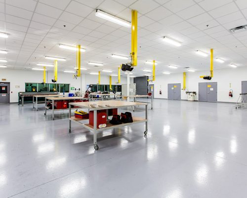 Large, bright room at Lufthansa Technik Heavy Maintenance Facility with several rollable tables.