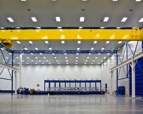 Interior of Spirit AeroSystems Composite Center. Large open room with fluorescent lighting.