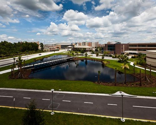 Stormwater retention basin adjacent to parking garage