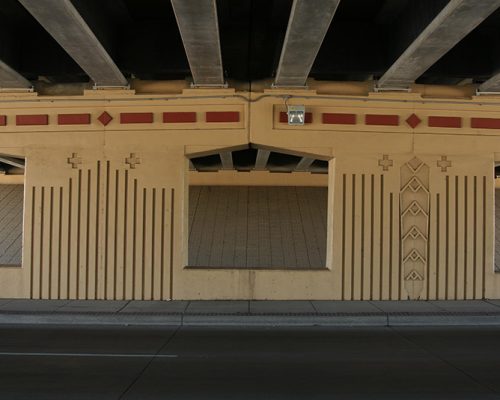 Detail of bridge piers beneath highway overpass
