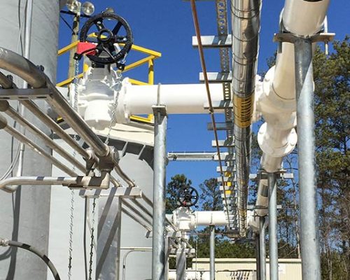 Exterior photo of Greenfield Biologics Facility process tanks and piping